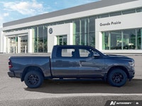 This 2021 Ram 1500 Sport Crew Cab, striking in Granite Crystal Metallic, stands ready for action, bo... (image 5)