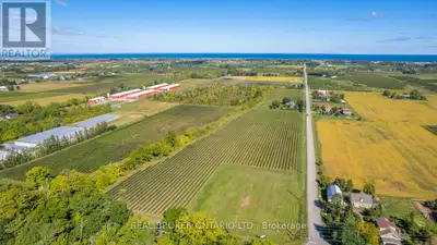 Rare Twenty Valley vineyard offering with 713' of prime frontage along Niagara's renowned Wine Route...