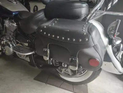 Upgrade your ride with these used Yamaha motorcycle saddlebags, featuring a classic studded leather...