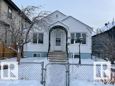 Welcome to very cute, raised bungalow on a nice wide street, Cozy kitchen offers white cabinets. Mai...