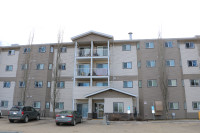 PRICE REDUCED!  Top floor, corner unit with 2 parking stalls!