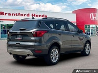 Confident command meets exceptional convenience in this superb gray 2019 Ford Escape SEL sport utili... (image 6)
