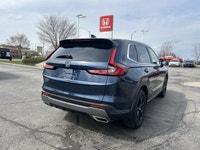 The 2024 Honda CR-V Hybrid EX-L in stunning Canyon River Blue Metallic offers an unparalleled blend... (image 4)