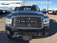 The 2023 Ram 2500 Laramie, in a striking black finish and equipped with a robust 4x4 drivetrain, pro... (image 5)