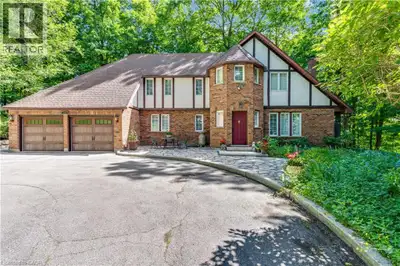 A long, tree-lined driveway welcomes you to this hidden gem in West Galt, one of Cambridge's most de...