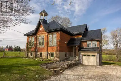 2 storey brick schoolhouse on a paved road with country views. Modern amenities and upgrades enhance...
