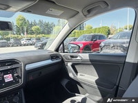 Navigate every journey with confidence and ease in the striking Black 2018 Volkswagen Tiguan Trendli... (image 7)