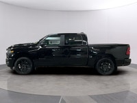 Experience the power and style of the 2026 Ram 1500 Sport, a striking black 4x4 truck designed to ha... (image 1)