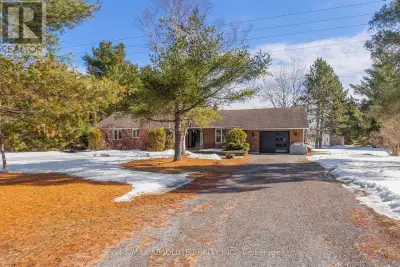 This custom all brick bungalow is set on approximately 1.8 acres in a great location with easy acces...