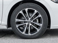 The 2024 Volkswagen Jetta Comfortline stands out in a refined White finish that complements its slee... (image 3)