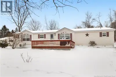 Welcome to 60 Memorial Dr. in Minto, a well maintained 3-bedroom, 2-bath mini home set on a landscap...