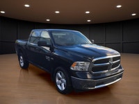 The 2022 Ram 1500 Classic SLT 4x4 Crew Cab in striking black is the perfect combination of power and... (image 3)