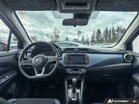 Designed for efficiency and confident urban navigation, this vibrant red 2024 Nissan Versa SV, is yo... (image 8)