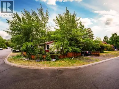 Welcome to 32 Tutshi Road! Situated on a large corner lot with mature trees in the highly sought-aft...