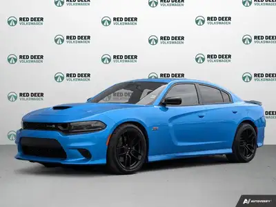 The 2023 Dodge Charger Scat Pack 392 in striking blue with a robust rear-wheel drive offers a dynami...