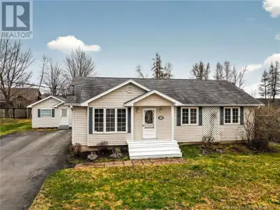 This meticulously maintained single-level home is designed for modern living and sits on a landscape...