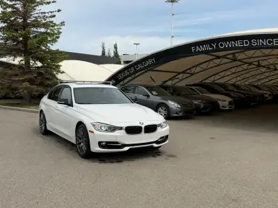 The 2013 BMW 328i xDrive F30 represents the transition to the high-efficiency, turbocharged four-cyl...