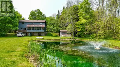 Welcome to your own private sanctuary nestled on over 8 acres of beautifully treed land in the heart...