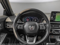 The 2026 Honda Civic Sedan Hybrid Sport Touring is a sophisticated blend of style and efficiency. It... (image 9)