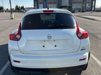This 2012 Nissan Juke (JAPANESE)is a reliable SUV with a stylish white exterior and a sleek black in... (image 3)