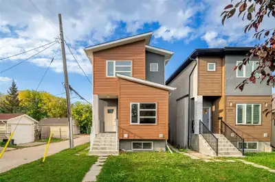 2B//Winnipeg/Open House SAT OCT 18 2-4PM. This Norwood property combines modern finishes, a flexible...