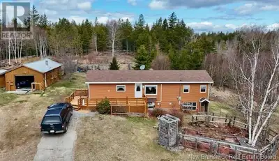 This beautiful bungalow with garage and additional workshop garage is the oasis you've been searchin...