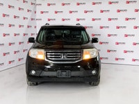 This 2014 Honda Pilot Touring gives you that dependable, comfortable feeling every time you drive it... (image 1)