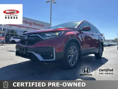 This 2021 Honda CR-V Sport, boasting a vibrant Radiant Red Metallic exterior and a sleek black inter...