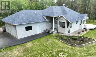 Surrounded by mature trees and nestled along the Fir River, this beautifully maintained property off...
