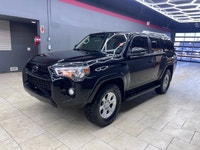 Experience the rugged elegance of the 2016 Toyota 4Runner SR5, presented in a commanding Black finis... (image 5)