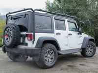 The 2018 Jeep Wrangler JK Unlimited Rubicon in stunning white with an all-wheel-drive system invites... (image 1)