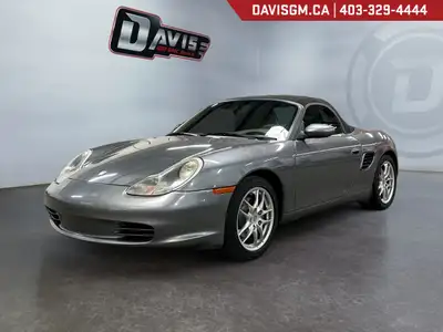 The 2003 Porsche Boxster captures the essence of pure roadster driving, a perfectly balanced mid-eng...