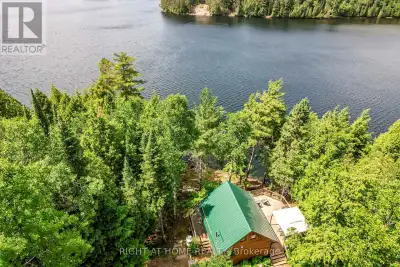 UPDATED FOR TRUE YEAR-ROUND COMFORT. This private Moccasin Lake retreat now features: a new propane...