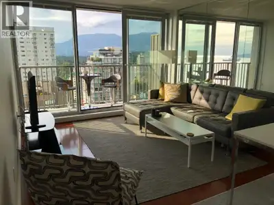 Simply stunning! This West End Vancouver Furnished Penthouse for Rent at Surfcrest offers 592 square...