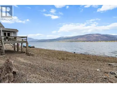 90 FEET OF DEEDED LAKEFRONT WITH CABIN, PLUS ROOM TO BUILD ACROSS THE ROAD! This 1.66 acre partially...