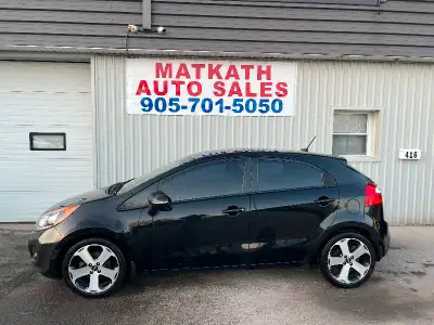 2013 Kia Rio EX Hatchback, 6 speed manual. Beautiful black exterior with dark grey leather interior....