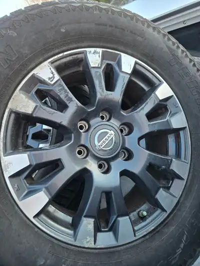 Four nice aluminum rims for nissan titan xd,They have censors l removed them to put 20s on truck all...