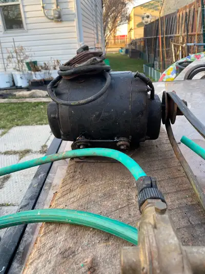 SUB PUMP with HOSES Used good condition Electric motor asking $25.00 Please Call 431-999-9930