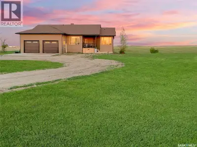 Set on 10.26 acres in the RM of Lacadena, this exceptional 1,800 sq. ft. bungalow is perfectly posit...