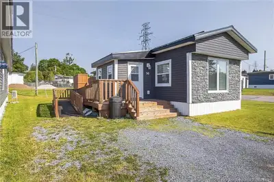Welcome to this beautifully renovated mini home in the desirable Garden Estates Community. Situated...