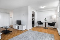 Fully renovated spacious suite features kitchen with modern features and finishes including laminate... (image 8)