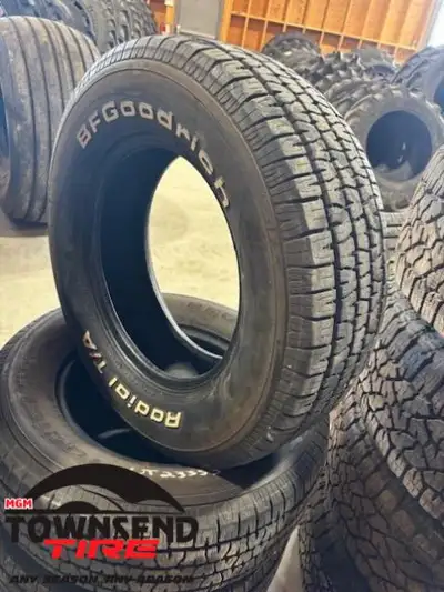 SET OF FOUR USED BFGOODRICH RADIAL TA RAISED WHITE LETTER TIRES, 205/70R14 SOLD AS SET OF FOUR ONLY,...