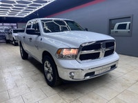 Get ready to own the roads with the stunning 2023 Ram 1500 Classic SLT 4x4 Crew Cab in a pristine wh... (image 1)