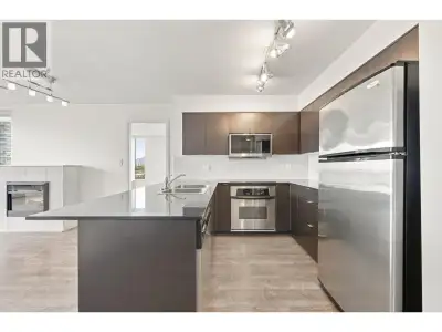 Leave the car at home! Bright, spacious, and steps from the Skytrain. This spacious sub-penthouse co...