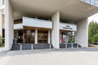 9500 Erickson Drive is set against the lush green hills of Burnaby, British Columbia at Lougheed Vil... (image 2)