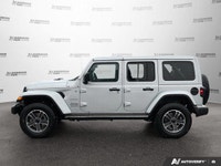 This Jeep Wrangler has a powerful Gas/Electric V-6 3.6 L/220 engine powering this Automatic transmis... (image 1)
