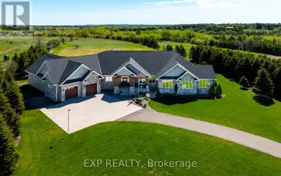 Set on a breathtaking 10.2-acre estate just 8 minutes from Orangeville, this one-of-a-kind custom-bu...