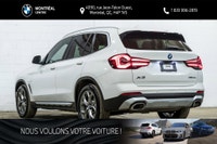 *English below* *Français:* Ce superbe BMW X3 xDrive30e 2023, affichant seulement 14 819 km, provien... (image 5)