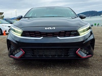 Presenting the 2024 Kia Forte5 GT in a sophisticated Black exterior with a smooth Front-Wheel Drive... (image 5)