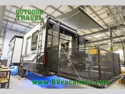 Grand Design Momentum M-Class toy hauler 344M highlights: Dual Opposing Slides Two Power Awnings 11'...